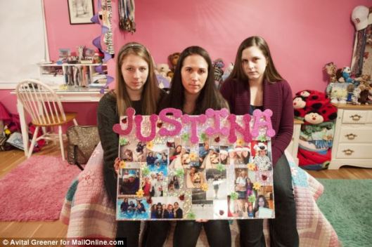 We miss you: Sitting on Justina's bed at her Connecticut home are her sisters: From left, Julia, Jennifer and Jessica. Jessica, far right, has been diagnosed as having the same Mitochondrial Disease that Justina was being treated for before she was 'kidnapped' after a visit to Boston Children's Hospital with a bout of the flu. Doctors there diagnosed her with a mental condition called Somatoform Disorder instead